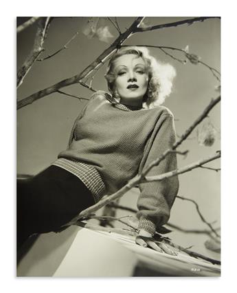 DIETRICH, MARLENE. Archive containing over 50 photographs, unsigned, some with holograph inscriptions,